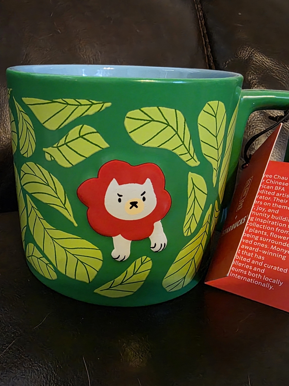 Starbucks Green Ceramic Mug with Red Lion and Yellow Leaf Design